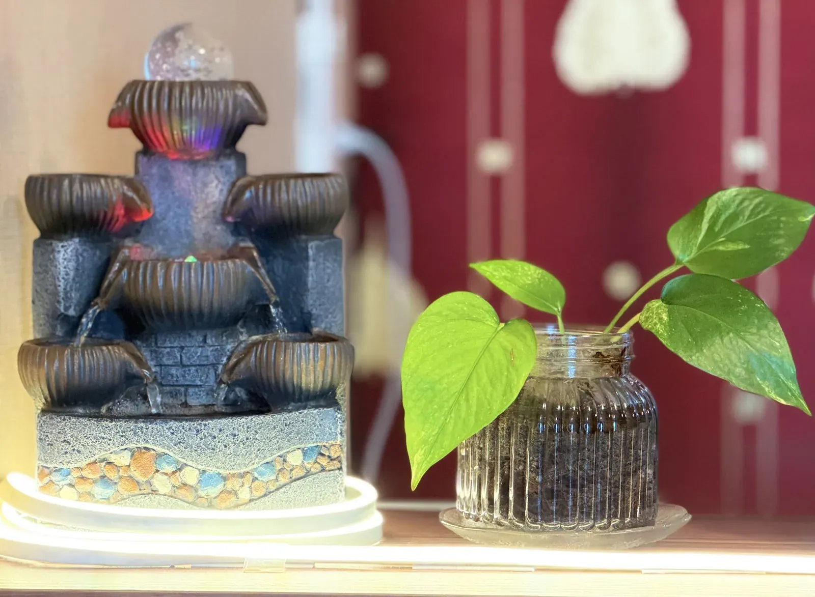A fountain and plants decorating the massage studio