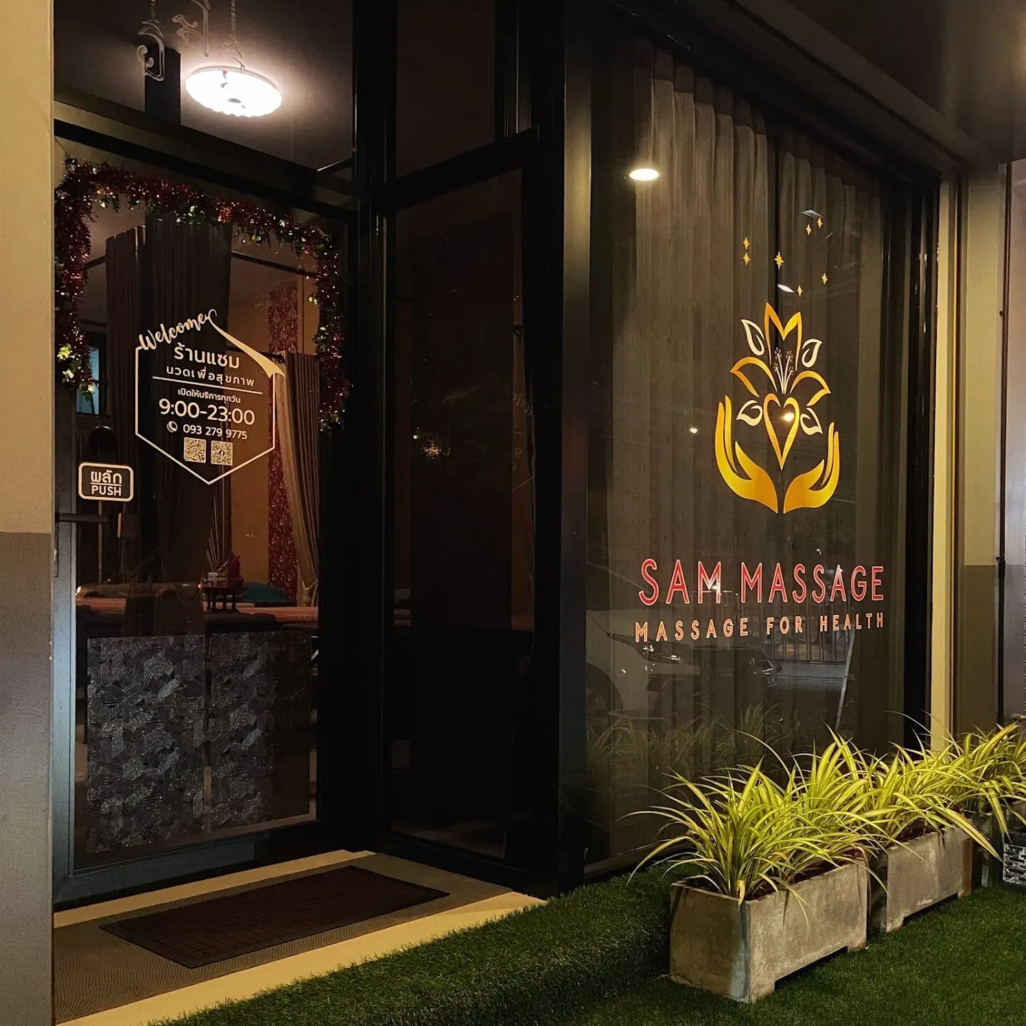 The entrance to SAM Massage in the evening