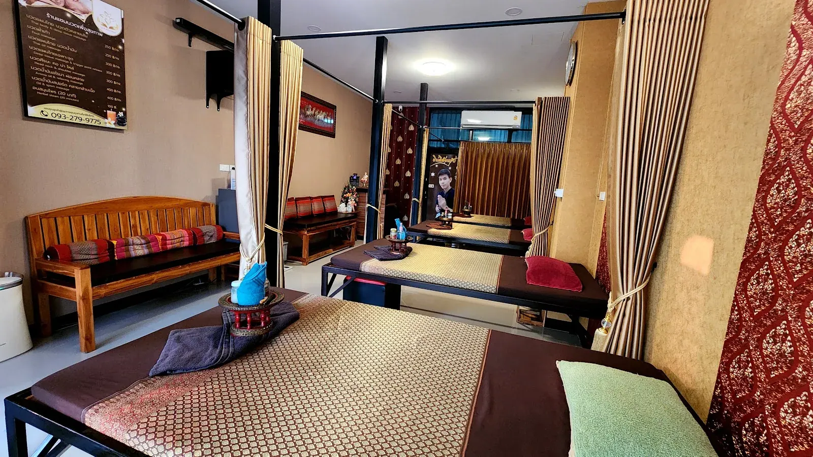 Treatment spaces separated by curtains inside SAM Massage