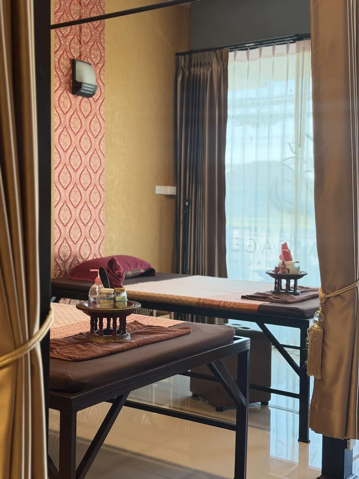 A private curtained treatment space inside SAM Massage