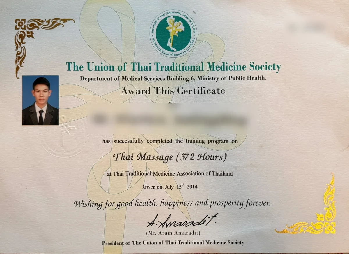 Sam’s 372-hour Thai massage training certificate with its document number redacted
